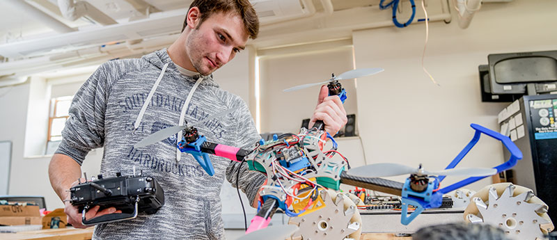 Student with robot drone